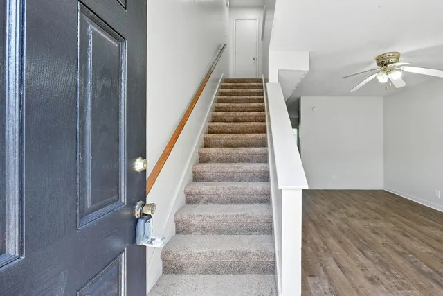 a view of staircase with white walls
