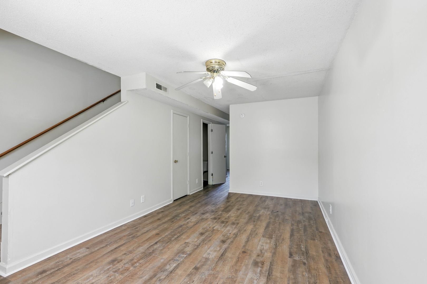 285 State Line Road Oak Grove, KY 42262 - Photo 4 of 18 a view of a room with wooden floor and a ceiling fan