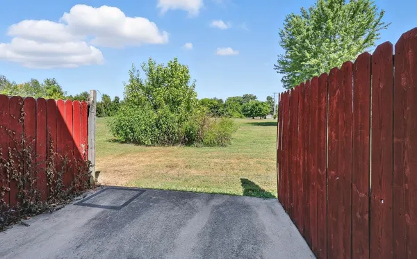 a view of a backyard of the house