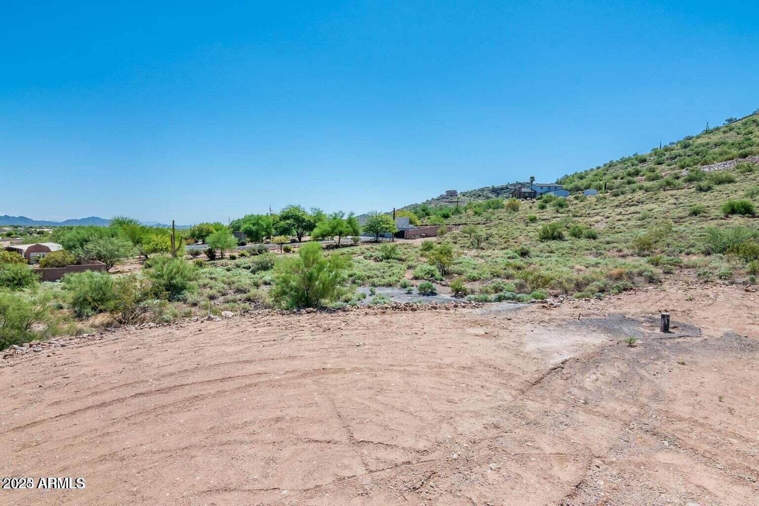 3451 West Irvine Road Phoenix, AZ 85086 - Photo 8 of 10 a view of a road with a yard