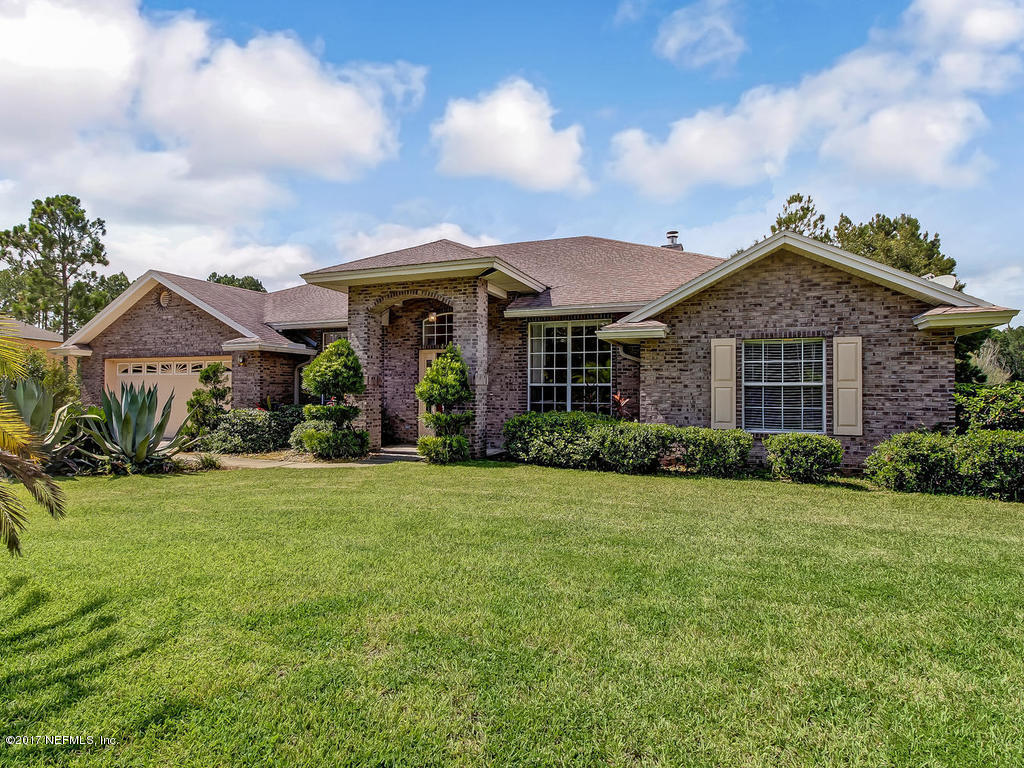 54651 Spring Lake Drive Callahan, FL 32011 - Photo 3 of 52 a front view of a house with garden
