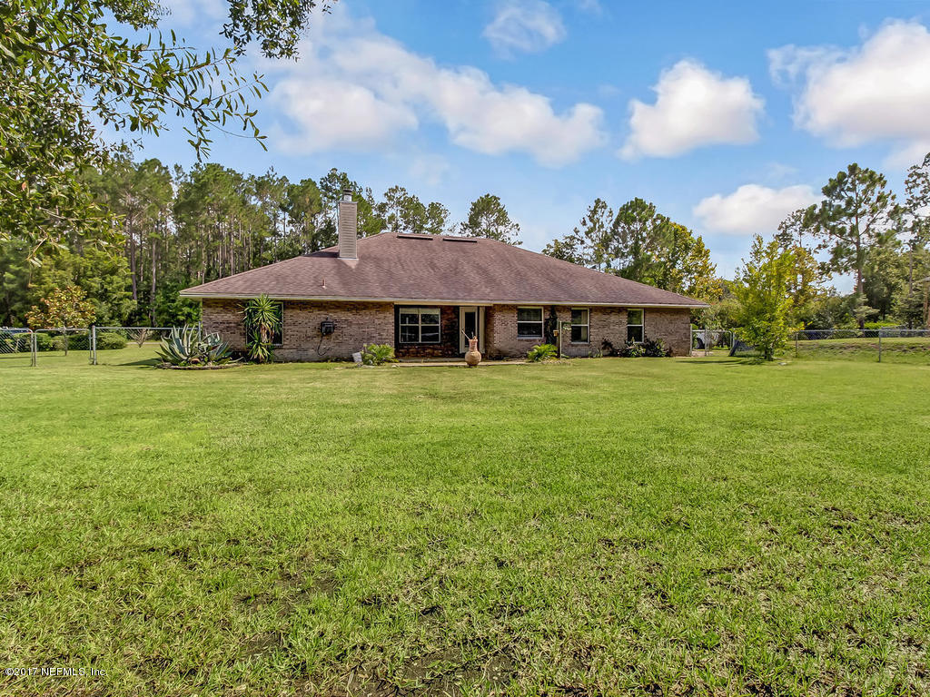 54651 Spring Lake Drive Callahan, FL 32011 - Photo 49 of 52 a view of a house with a yard