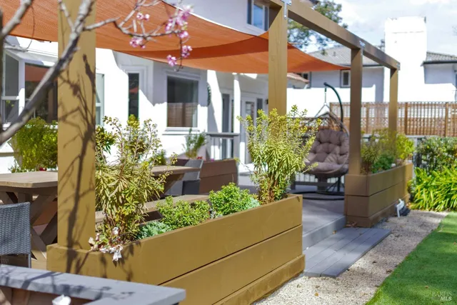 a view of a backyard with sitting area and furniture