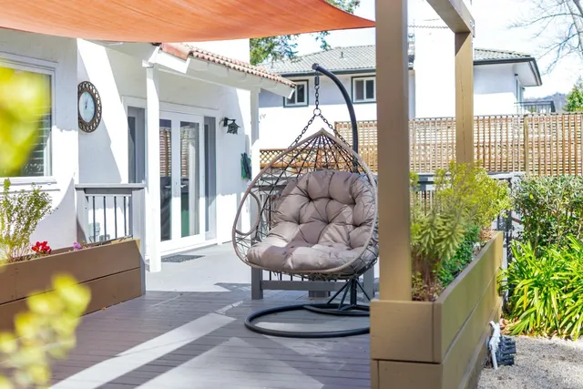 a patio with table and chairs