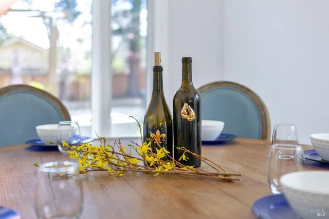 a bedroom with a large bed and a flat tv screen on dresser