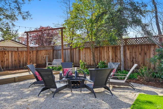 a spacious bedroom with a bed and a chandelier