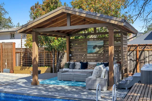 a bathroom with a granite countertop sink a toilet and a mirror