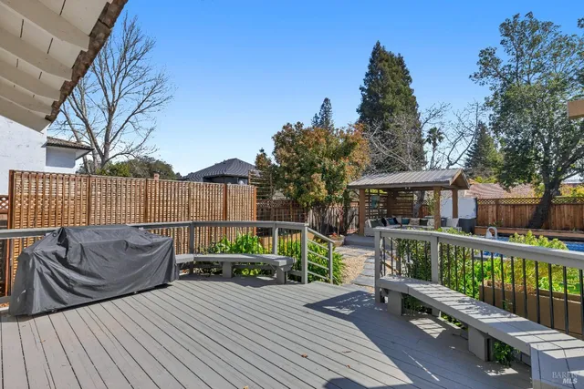 a living room with furniture and large windows