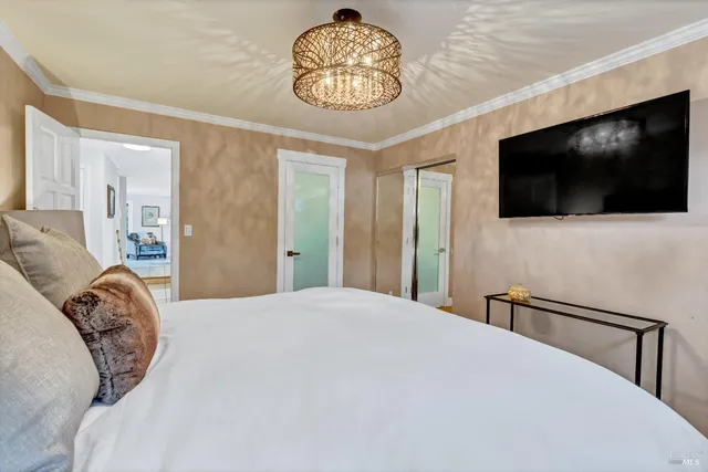 a bed room with a bed and a lamp