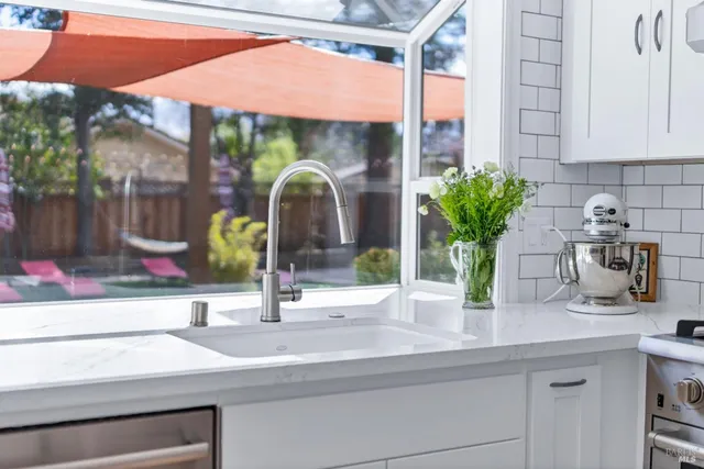 a view of a room with chairs and table