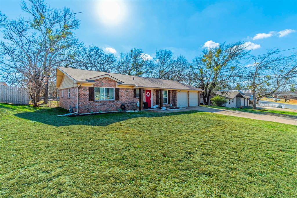 708 North Stewart Street Azle, TX 76020 - Photo 22 of 25 Expansive front lawn on an oversized lot with plenty of space to enjoy outdoor living.