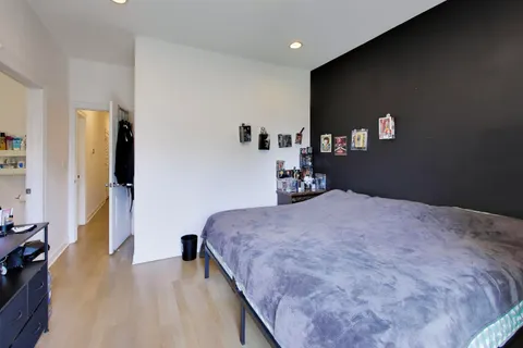 a bedroom with bed and window