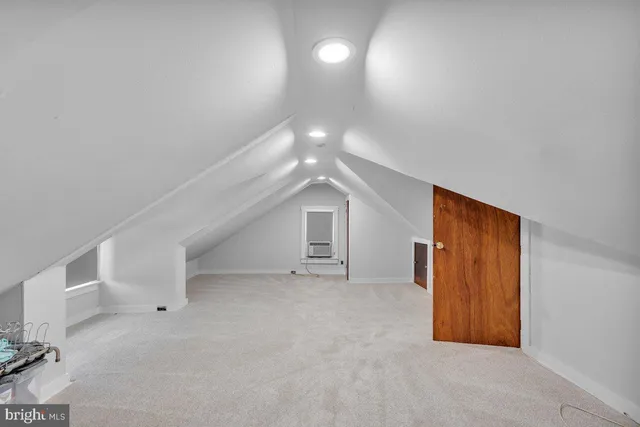 en empty room with windows and entrance