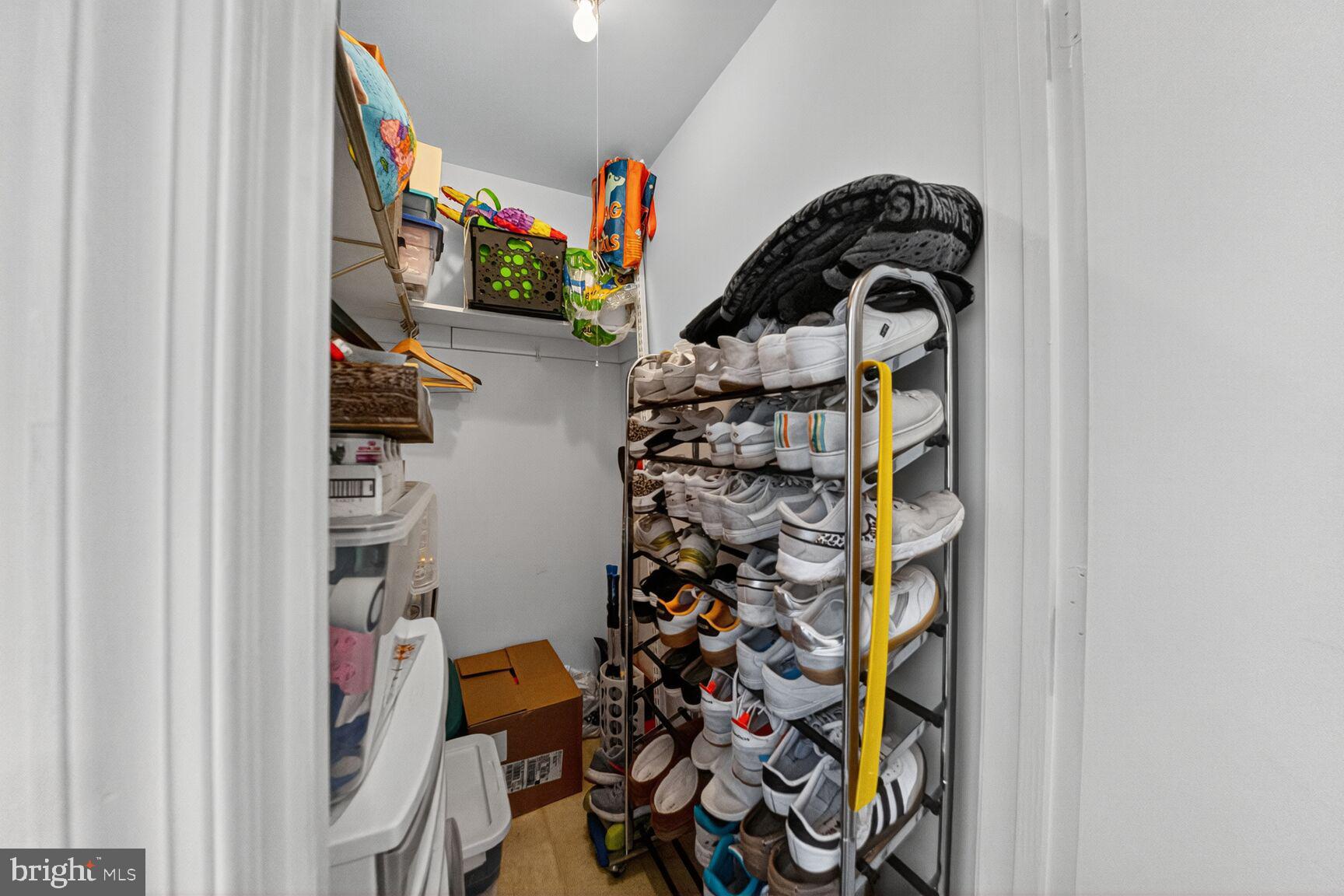 14901 McKisson Court, Unit 7CC Silver Spring, MD 20906 - Photo 18 of 34 walk in closet with clothes and shoes