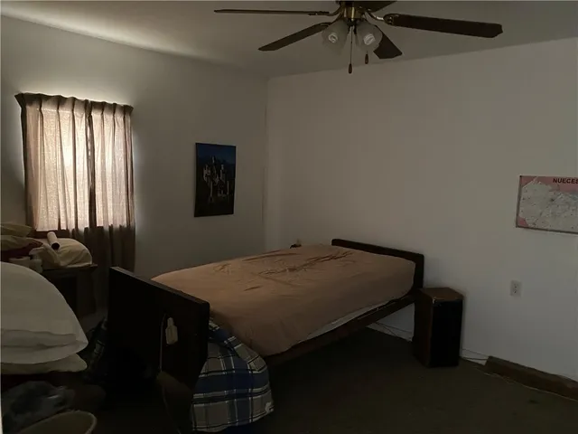 a room that has a bed and a table in it