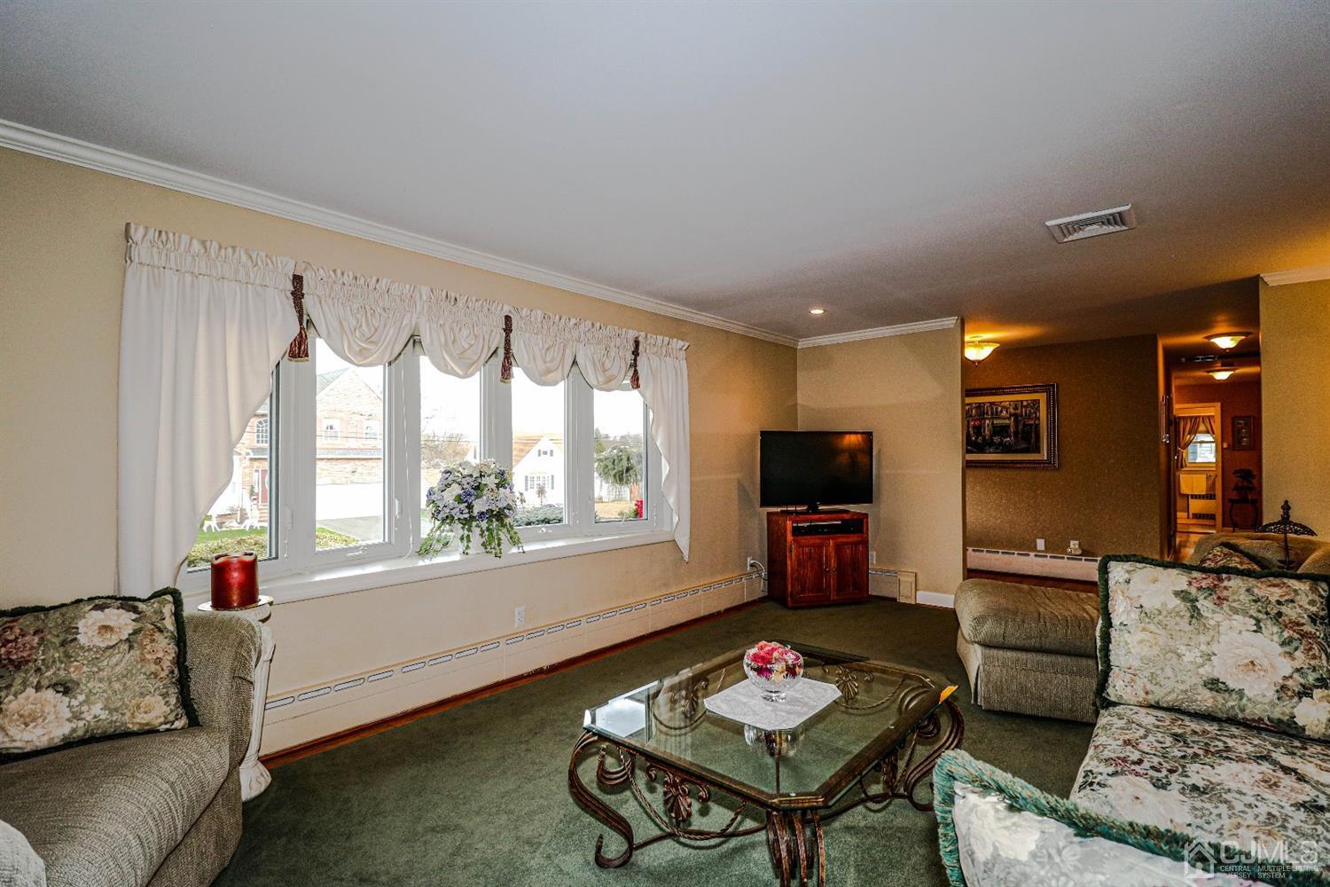 147 Oxford Road Colonia, NJ 07067 - Photo 14 of 31 Sunlight streams through the beautiful bow window into this exquisite Formal Living room.