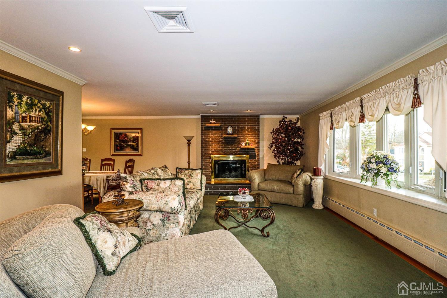 147 Oxford Road Colonia, NJ 07067 - Photo 15 of 31 Glamorous Formal Living room with hard wood floors, recessed lights that dim, romantic wood burning fireplace and crown molding. Breathtaking room.