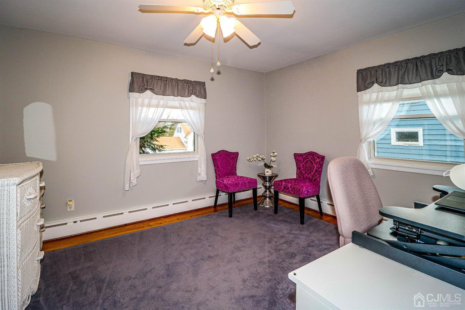 147 Oxford Road Colonia, NJ 07067 - Photo 21 of 31 The stylish, spacious third bedroom, currently used as an office features hard wood floors and ceiling fan.