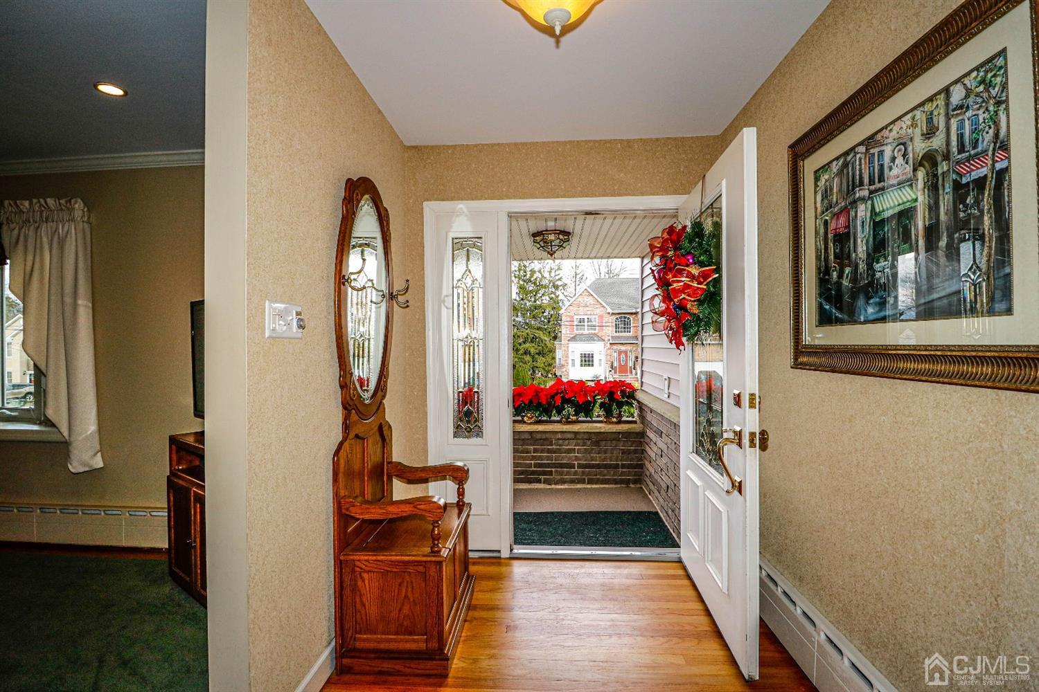 147 Oxford Road Colonia, NJ 07067 - Photo 4 of 31 The foyer is sunny and bright with hard wood floors and upgraded front door with leaded glass.