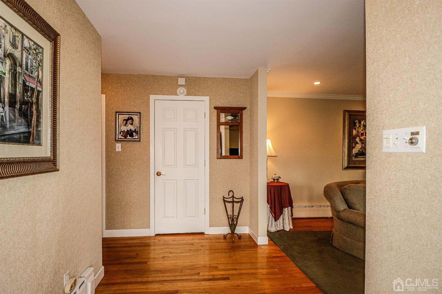 147 Oxford Road Colonia, NJ 07067 - Photo 5 of 31 View of foyer from front door. Features guest closet and entrance to enormous Formal Living room to the right.