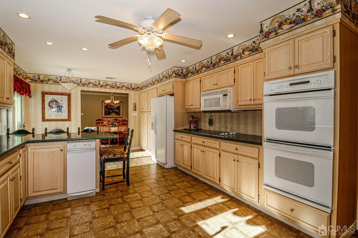 147 Oxford Road Colonia, NJ 07067 - Photo 7 of 31 View of double oven, micro wave, counter cook top, refrigerator and pantry. Immaculate condition.