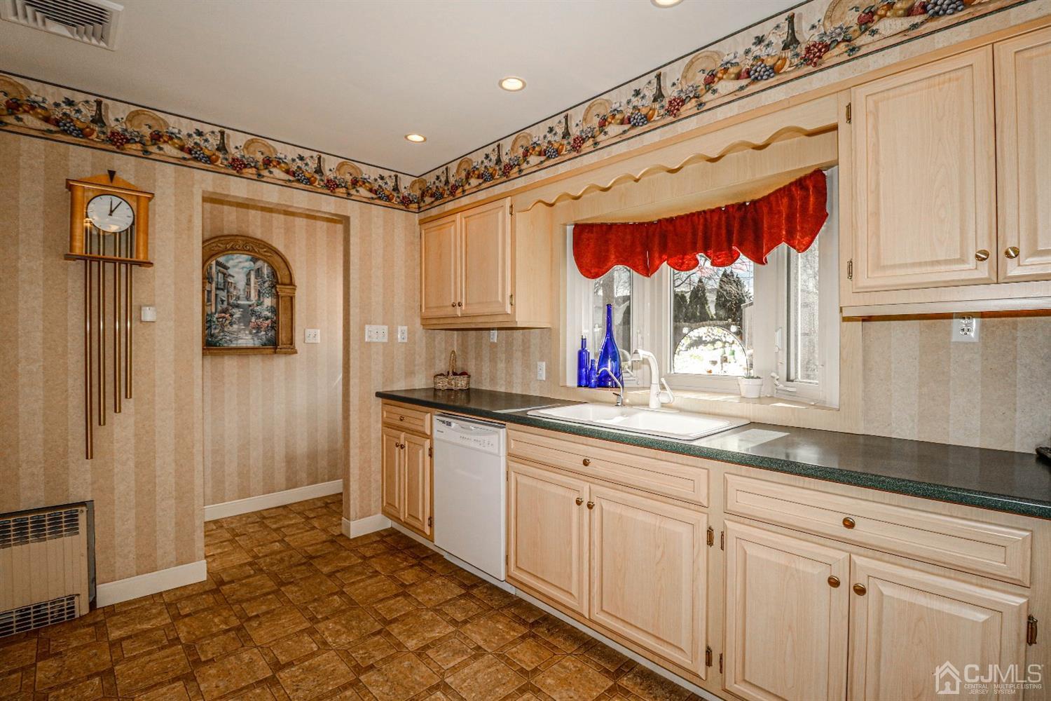 147 Oxford Road Colonia, NJ 07067 - Photo 8 of 31 Bay Window over the double sink provides views of the enormous back yard through every season.