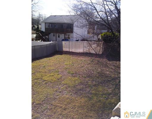 62 Meadow Road Edison, NJ 08817 - Photo 14 of 14 a view of a backyard with sitting area and furniture