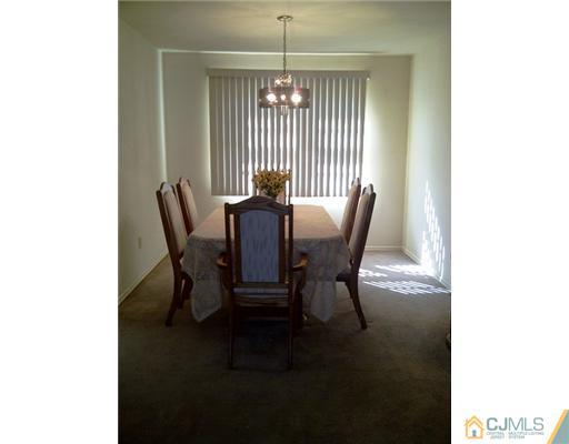 62 Meadow Road Edison, NJ 08817 - Photo 3 of 14 a view of a dining room with furniture and window