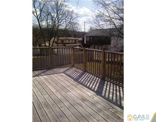 62 Meadow Road Edison, NJ 08817 - Photo 8 of 14 a view of balcony with wooden floor