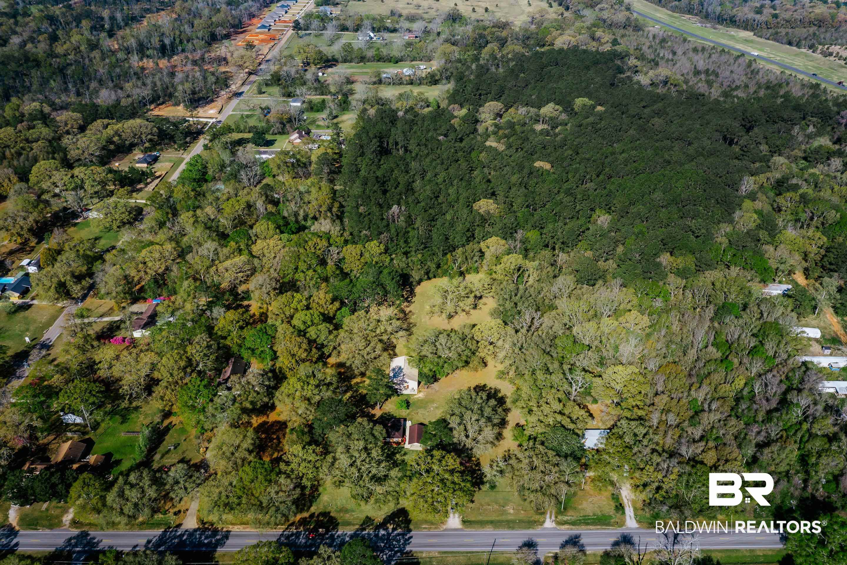 5151 McCrary Road Semmes, AL 36575 - Photo 6 of 62 View of property location featuring a heavily wooded area