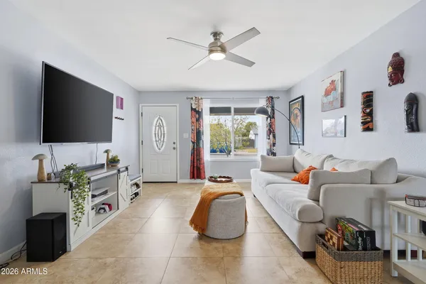 a living room with furniture and a flat screen tv
