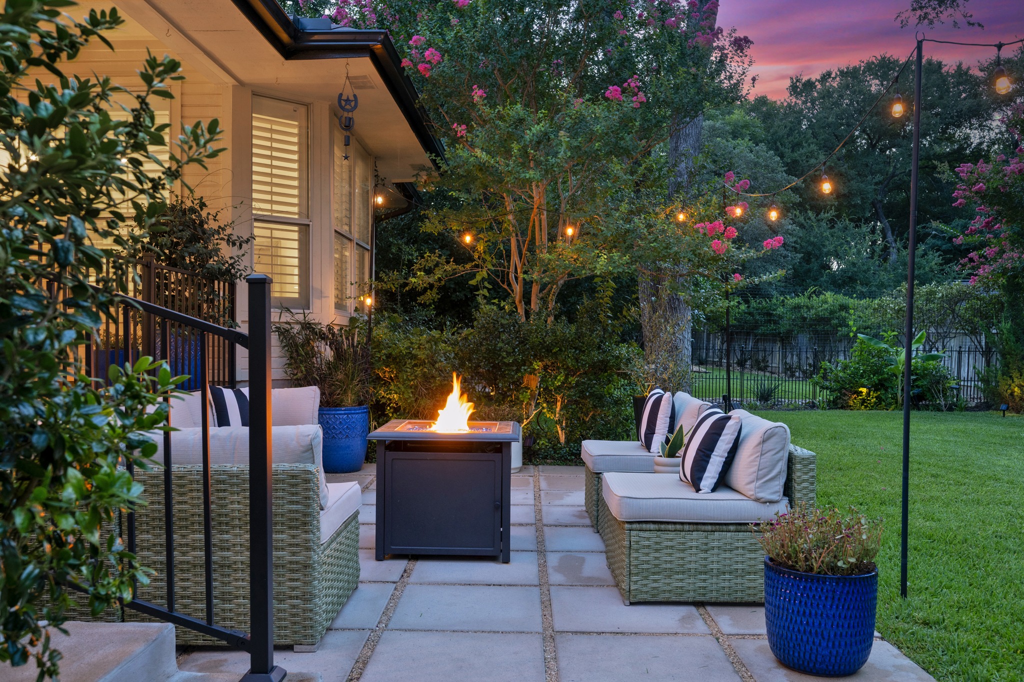 30115 Sawgrass Trail Georgetown, TX 78628 - Photo 17 of 37 An inviting outdoor patio offers cozy seating around a modern fire pit, perfect for evening gatherings.