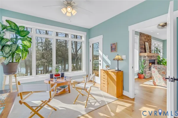 a living room filled with furniture and a potted plant