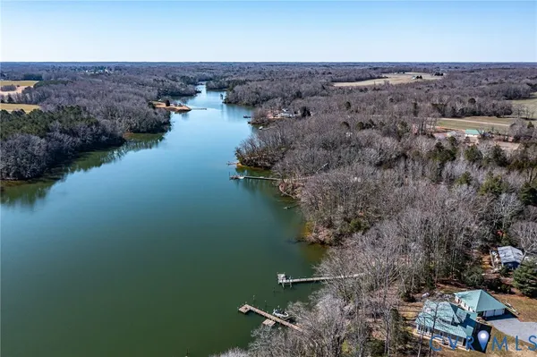 an aerial view of valley and lake