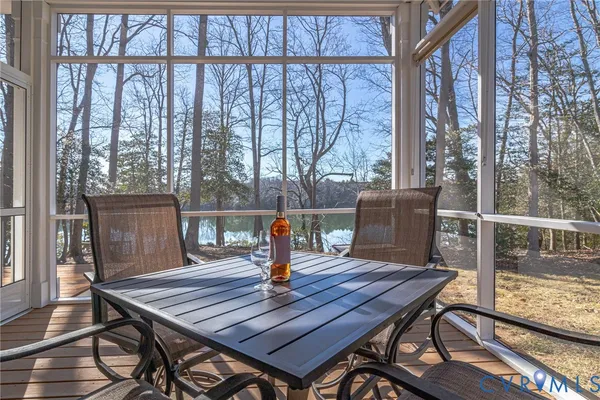 a view of a wooden deck and a lake view