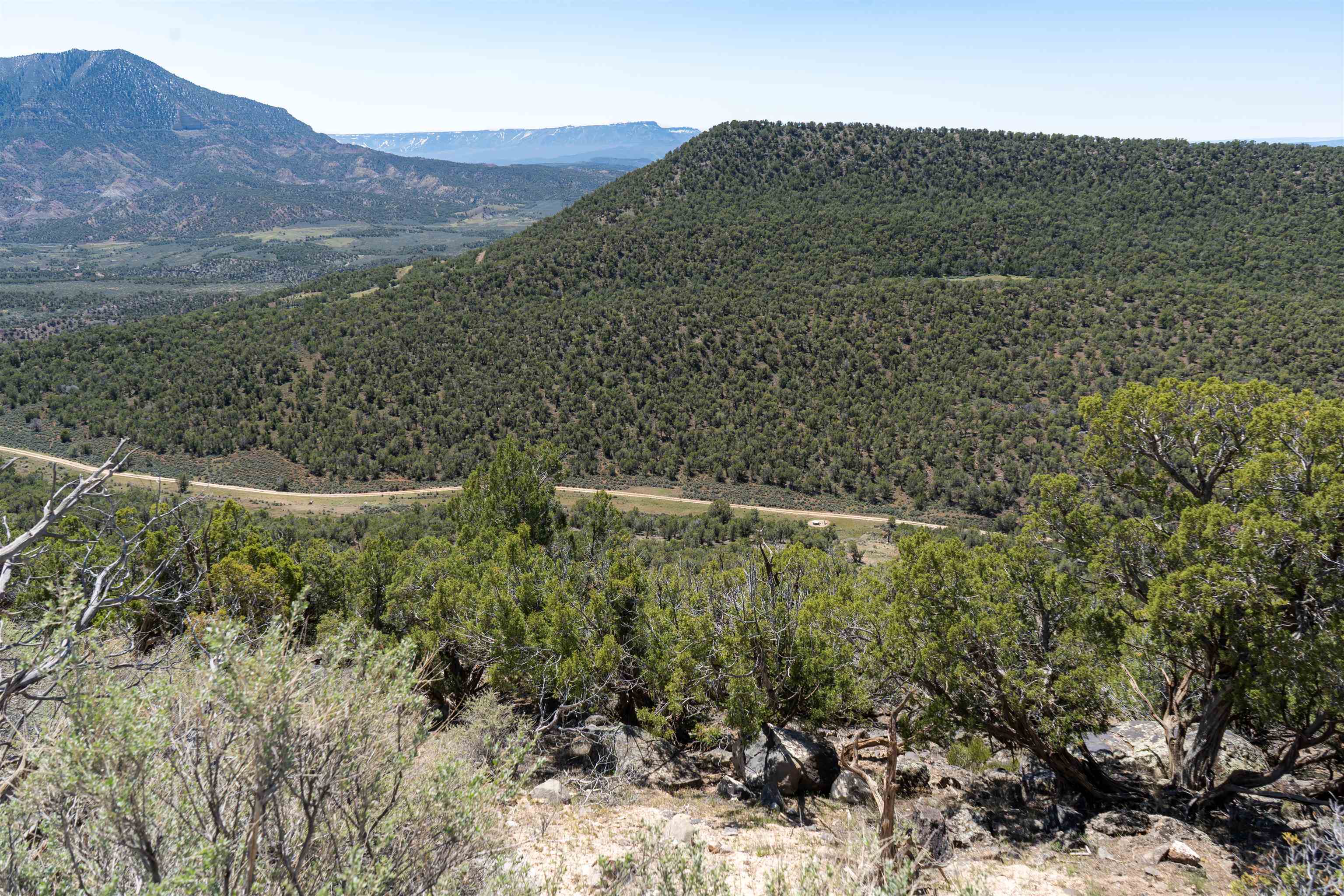 Tbd T Road De Beque, CO 81630 - Photo 10 of 25 a view of a dry yard with mountains and green space