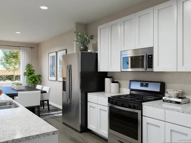 a bedroom with bed and painting on the wall