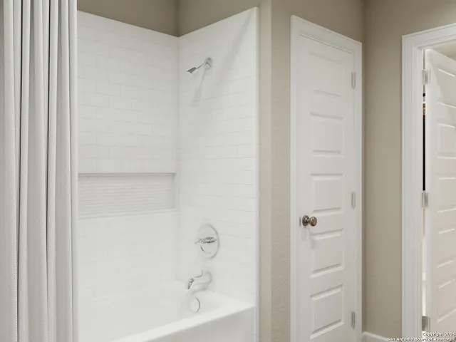 a bathroom with a granite countertop sink mirror and toilet