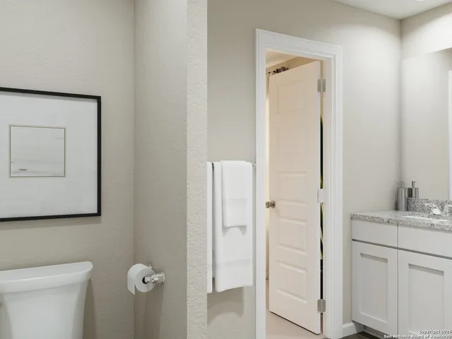 a view of walk in closet with clothes