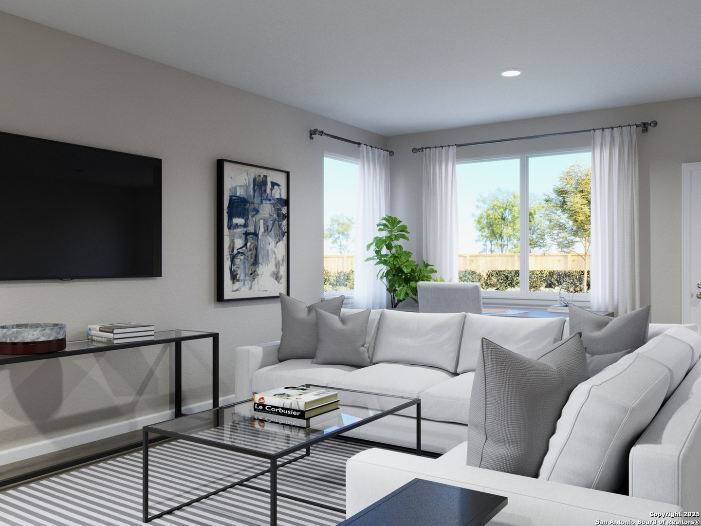 11103 Luckenbach Loop Converse, TX 78109 - Photo 8 of 28 a living room with furniture and a flat screen tv