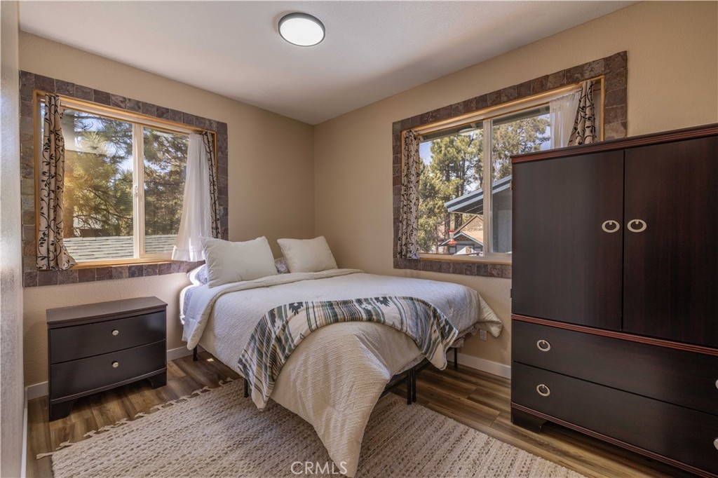 196 Sunset Lane Sugarloaf, CA 92386 - Photo 12 of 26 a bedroom with a bed and a window