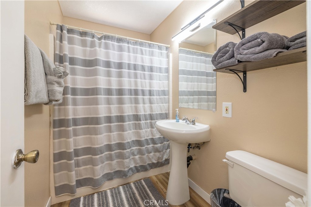 196 Sunset Lane Sugarloaf, CA 92386 - Photo 14 of 26 a bathroom with a sink a toilet and shower