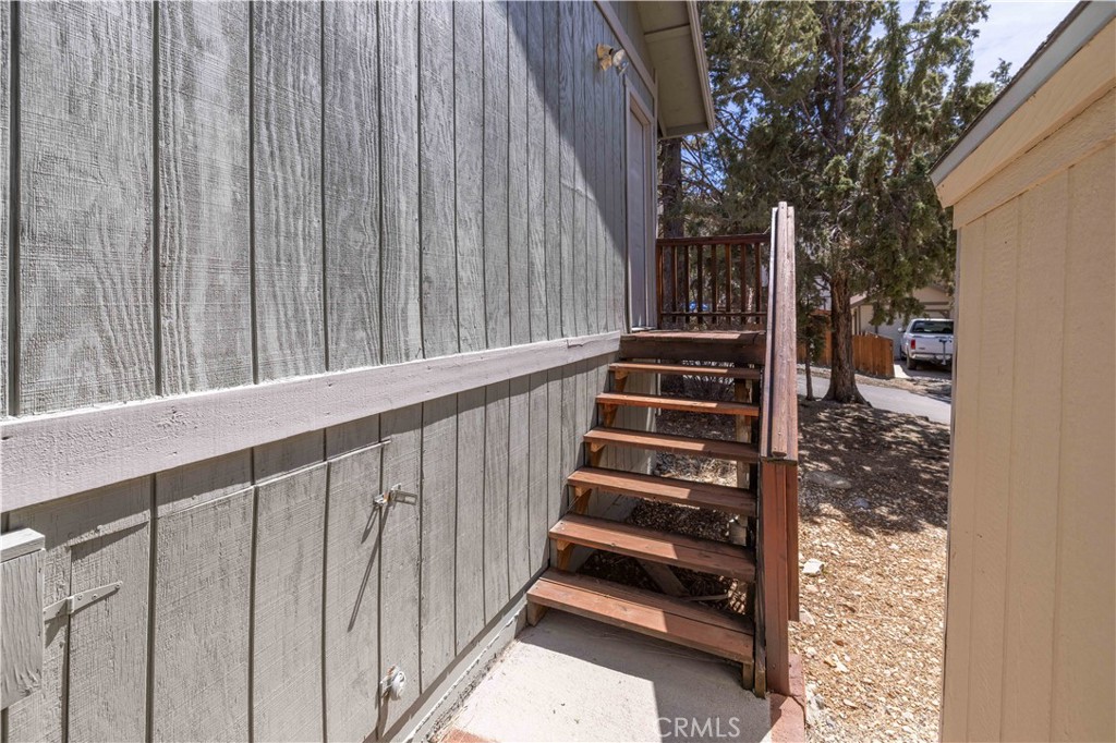 196 Sunset Lane Sugarloaf, CA 92386 - Photo 18 of 26 a view of staircase with white walls and a window