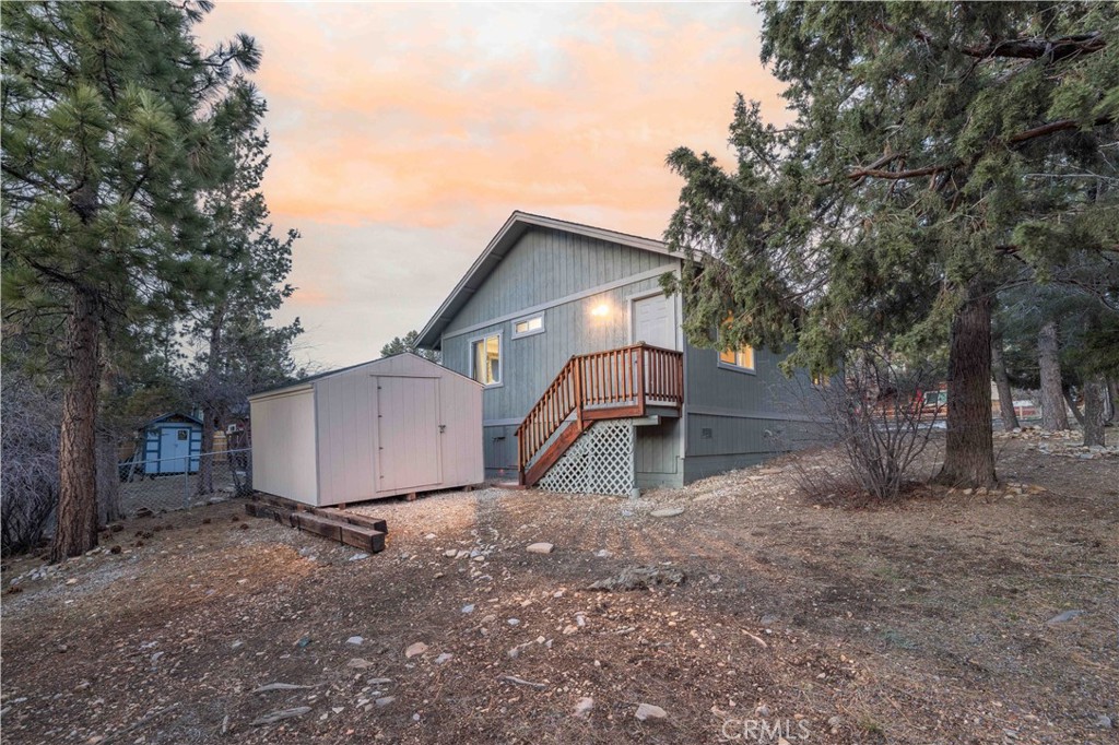 196 Sunset Lane Sugarloaf, CA 92386 - Photo 26 of 26 a view of a house with a yard and tree