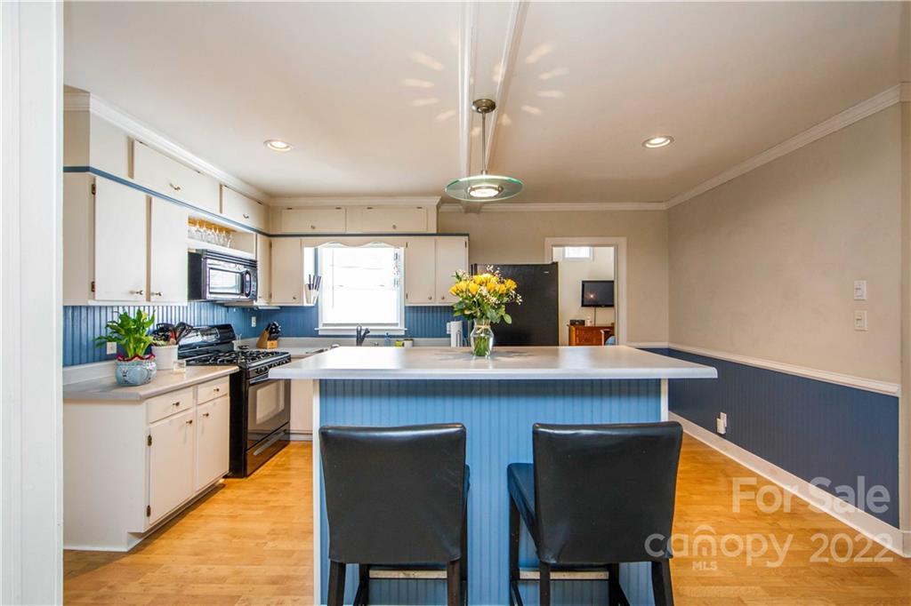 3200 Dublin Road Charlotte, NC 28208 - Photo 13 of 48 a kitchen with a sink cabinets and wooden floor
