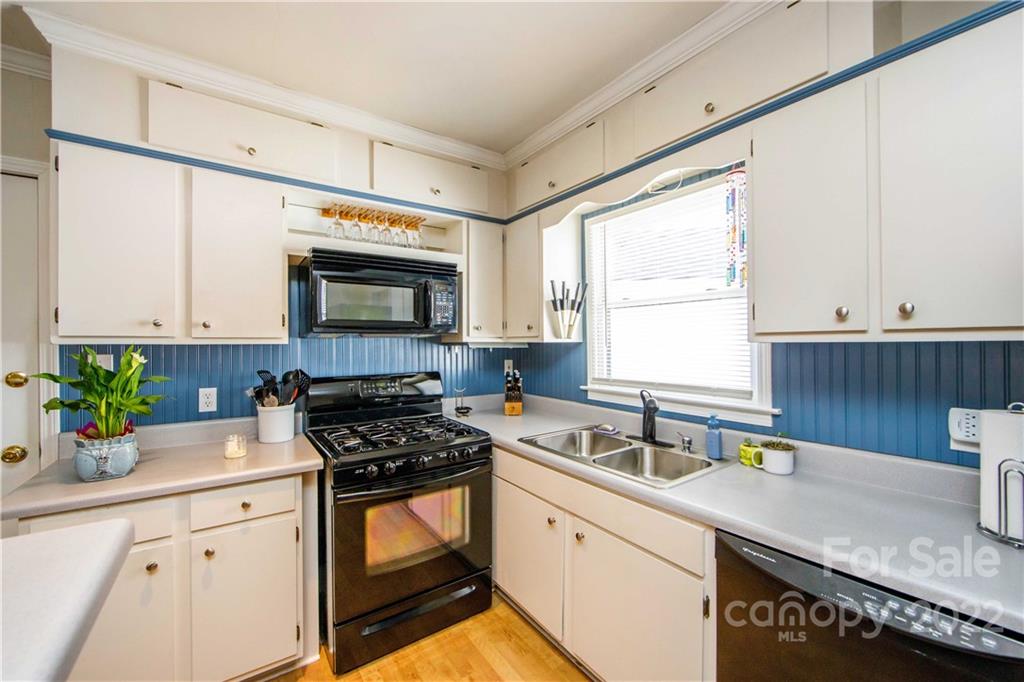 3200 Dublin Road Charlotte, NC 28208 - Photo 16 of 48 a kitchen with stainless steel appliances a sink a stove a microwave a sink and cabinets