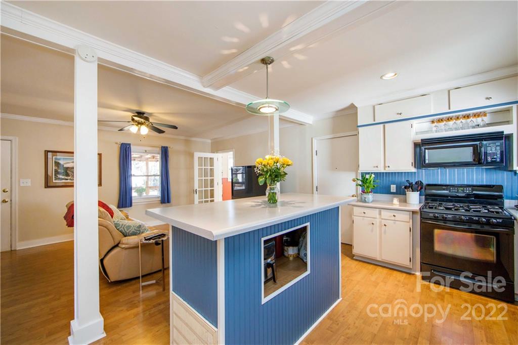 3200 Dublin Road Charlotte, NC 28208 - Photo 19 of 48 a kitchen with a stove cabinets and wooden floor