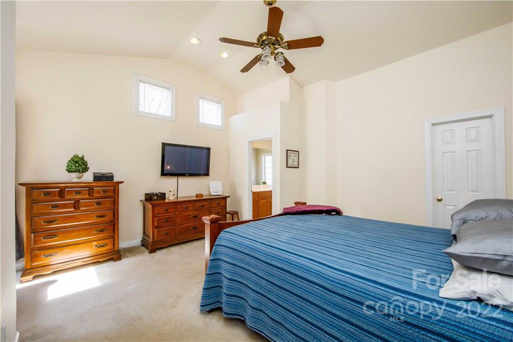 3200 Dublin Road Charlotte, NC 28208 - Photo 25 of 48 a bedroom with furniture and a flat screen tv