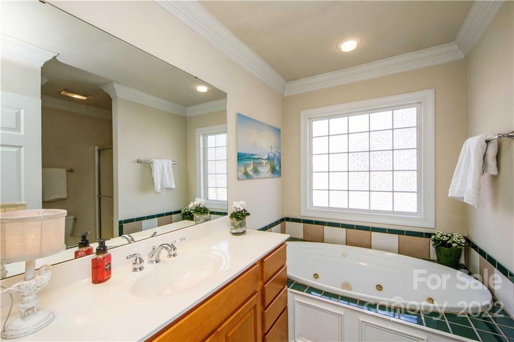 3200 Dublin Road Charlotte, NC 28208 - Photo 27 of 48 a bathroom with a tub a sink and a window