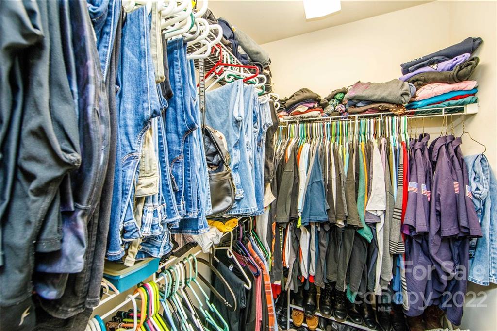 3200 Dublin Road Charlotte, NC 28208 - Photo 29 of 48 a view of walk in closet with clothes and shoes
